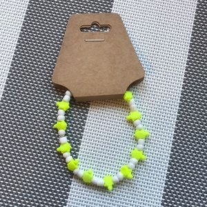 Neon yellow turtle and white bracelet